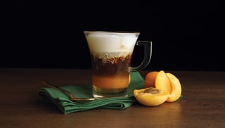 juice ice coffe with milk foam packshot